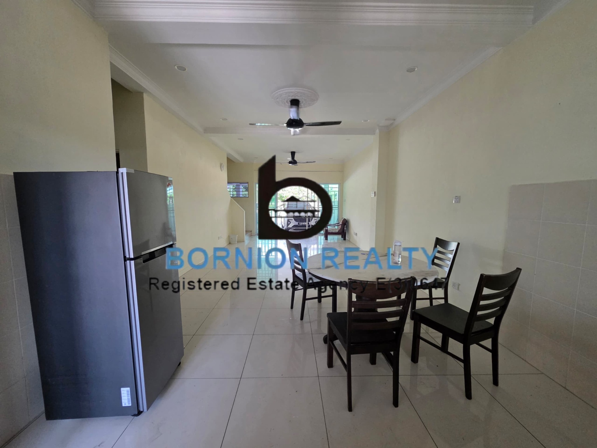 Dining area leading to the living room at Taman Rimba Bandar Sierra