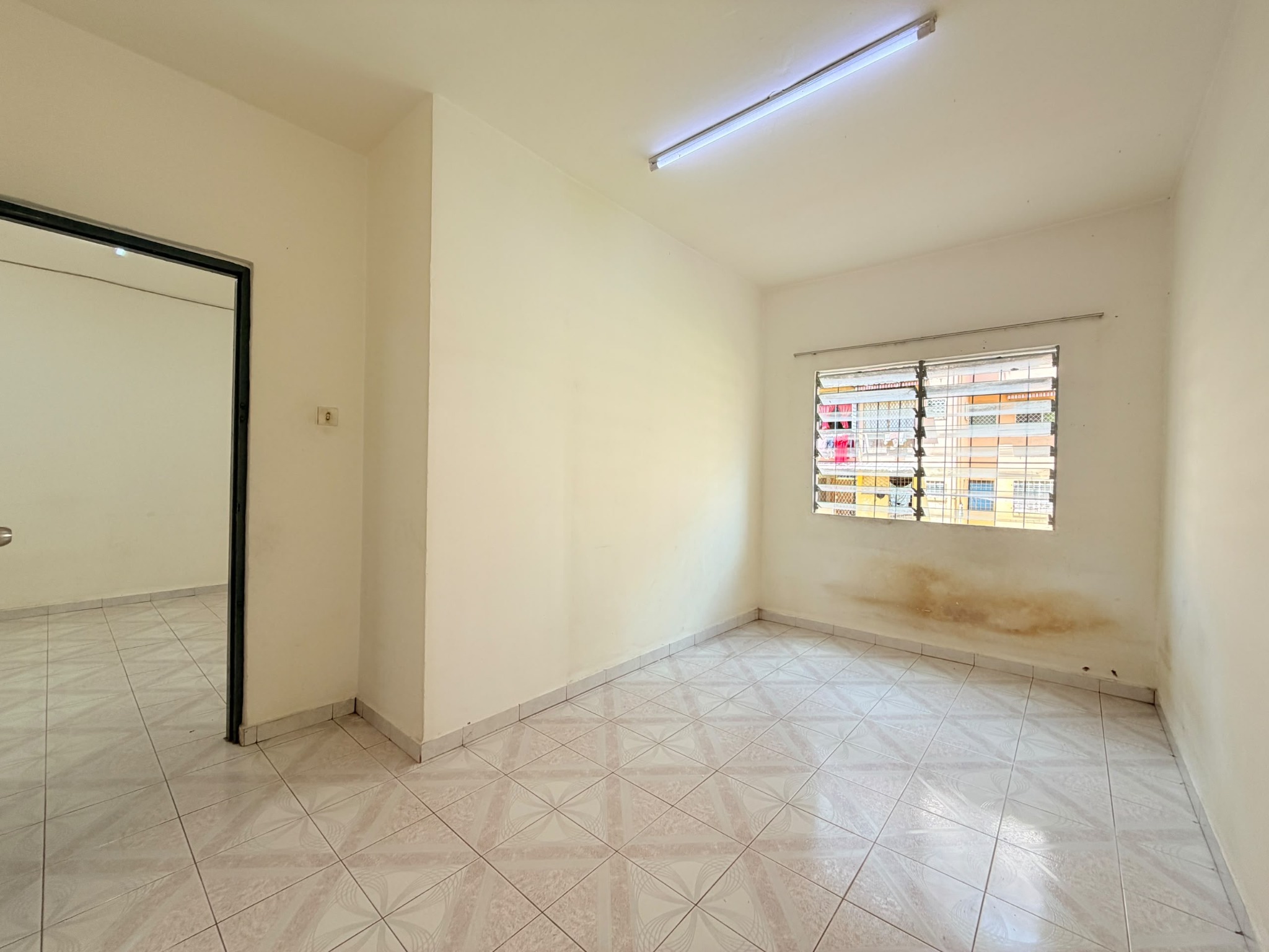 Bedroom and adjoining room at Telipok Ria Apartment