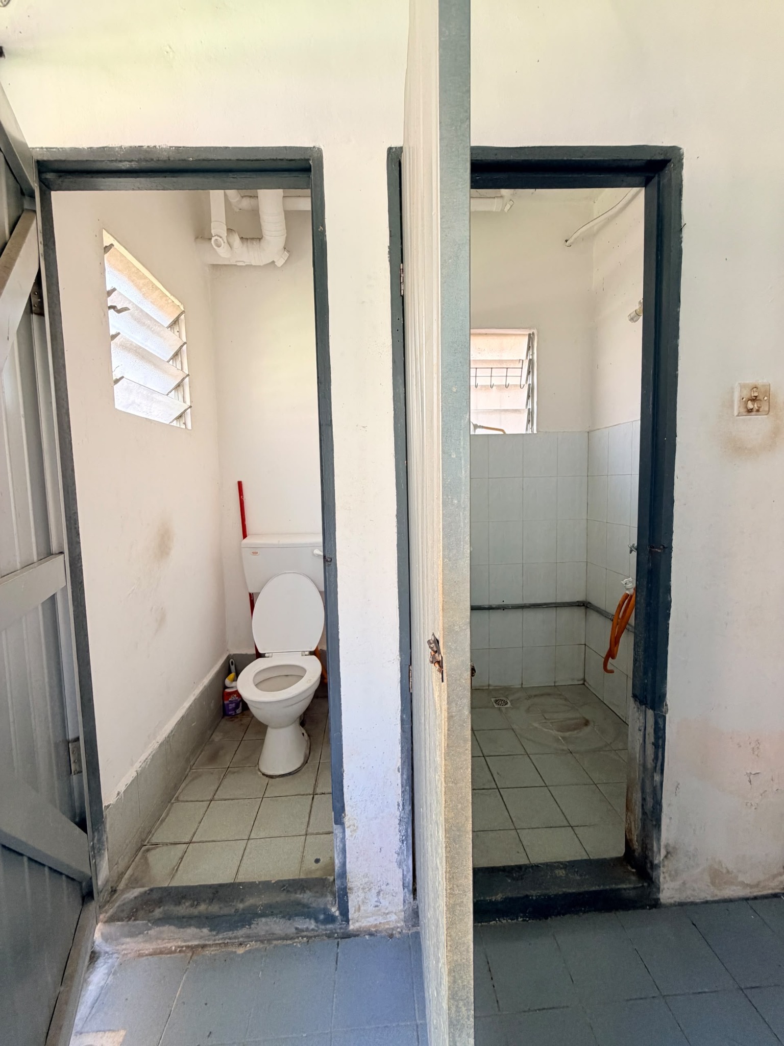 Separate toilet and bathroom at Telipok Ria Apartment