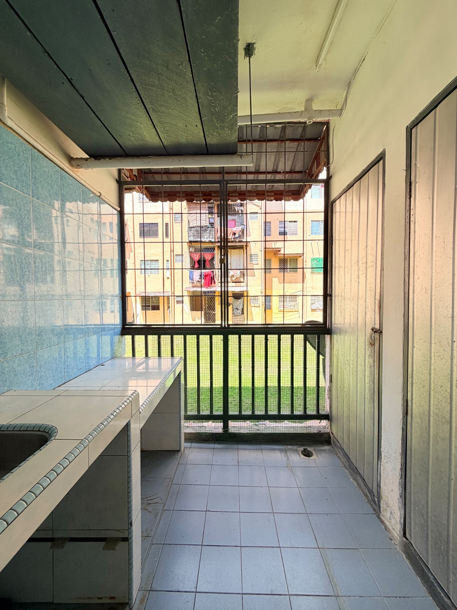 Second view of the kitchen and utility area at Telipok Ria Apartment